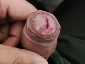 Young Asian boy enjoys playing with his penis