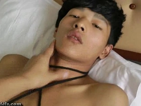 Gay BDSM scene with Asian teens and bigcock boys giving handjobs while they are tied up.